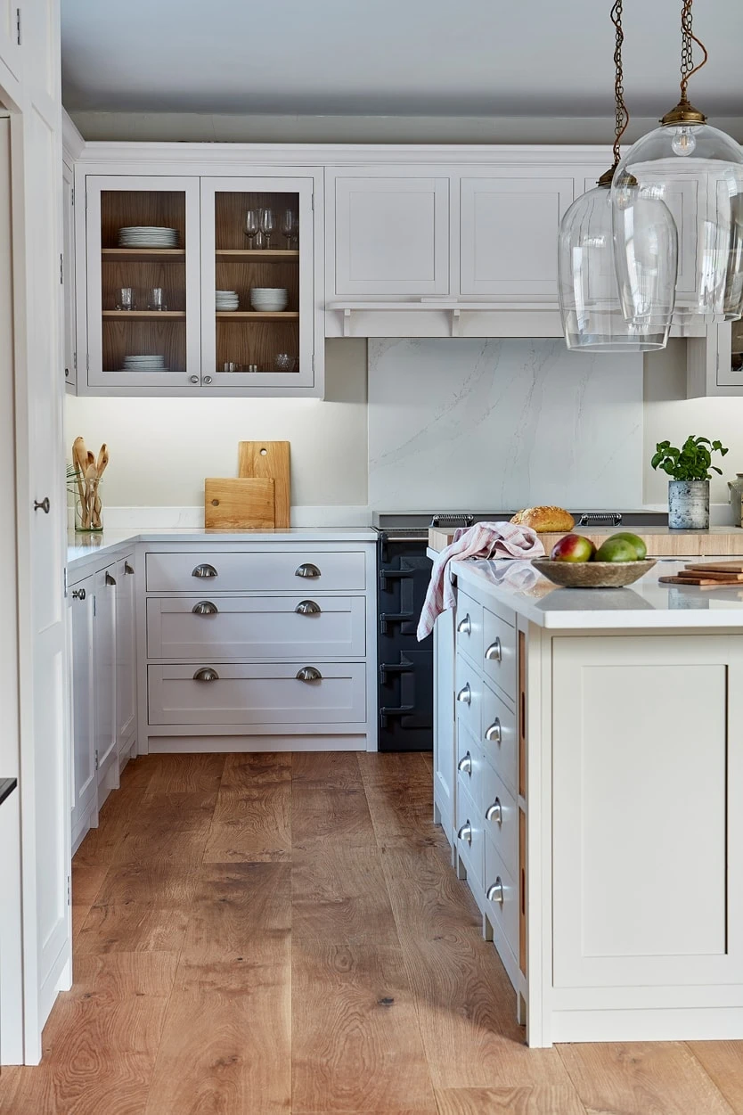 A detailed view of the Hertfordshire Manor kitchen's hardware, featuring silver handles and knobs that add a touch of elegance and sophistication to the design. The hardware complements the white Shaker cabinets and oak accents, creating a cohesive and refined aesthetic.