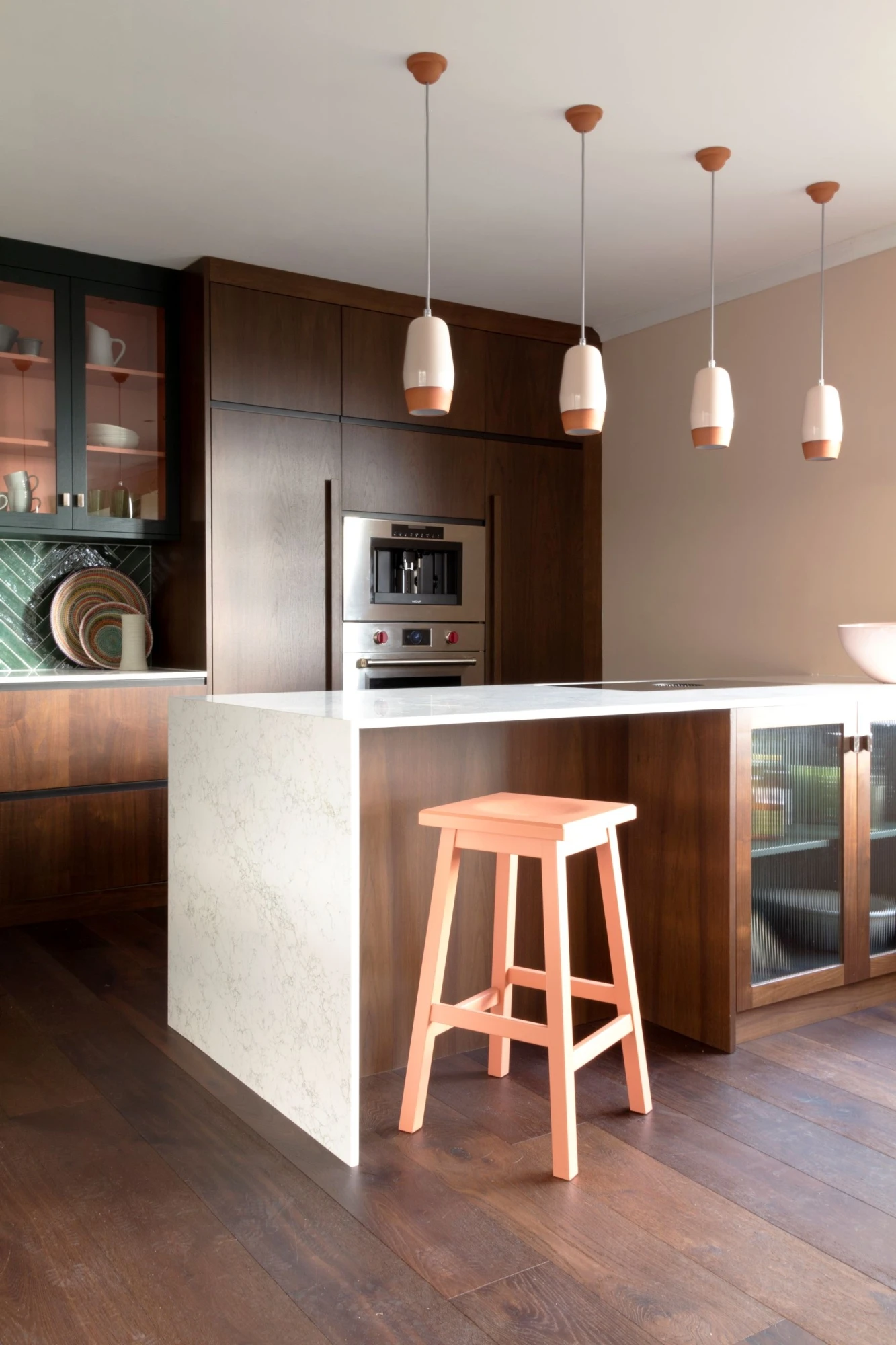 A harmonious blend of walnut cabinets, and brass accents, creating a captivating and luxurious atmosphere in the Blenheim kitchen.