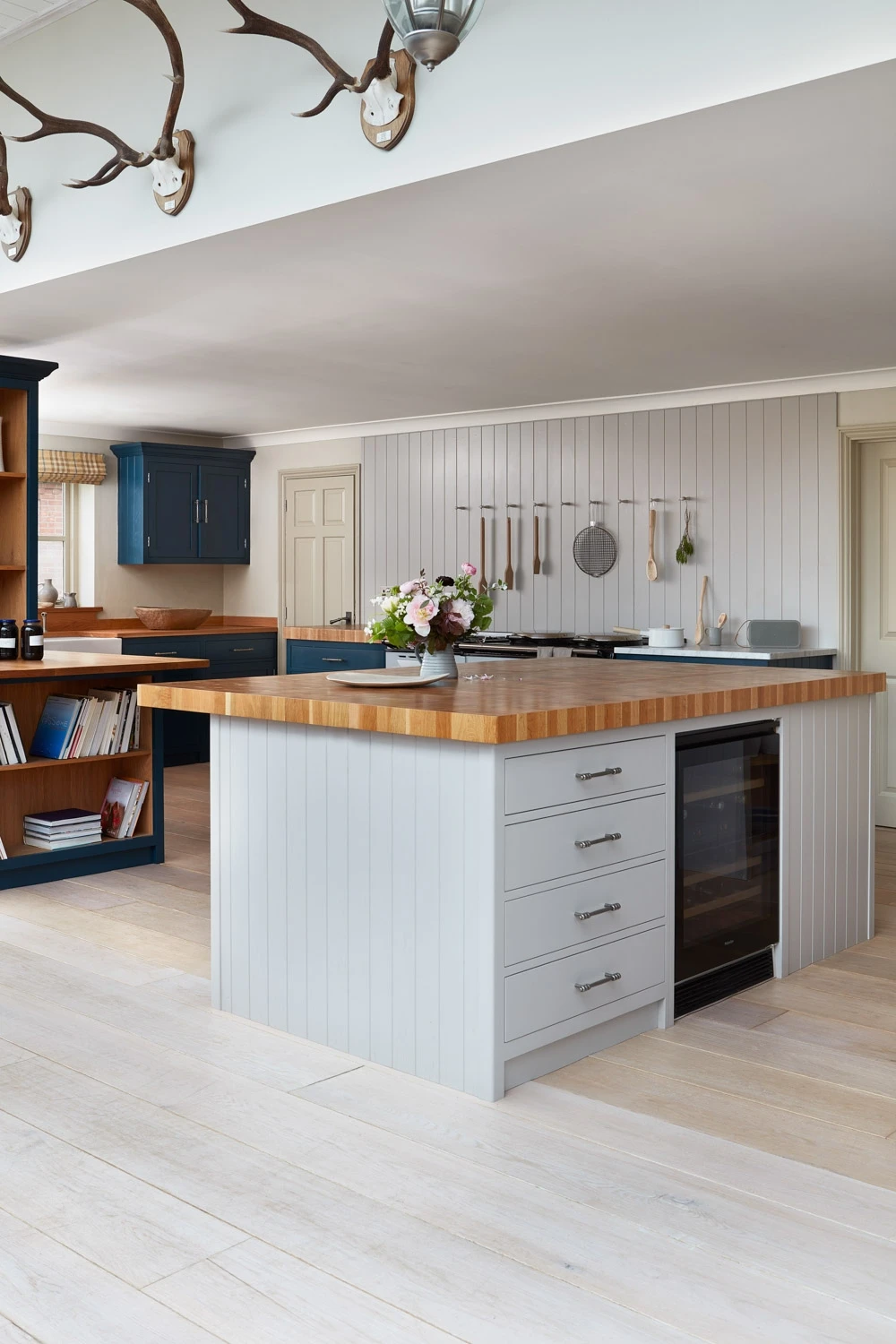 A stylish central island anchors the Cley kitchen, providing additional workspace and seating. The island's quartz countertop seamlessly integrates into the cabinets, creating a cohesive and elegant design..