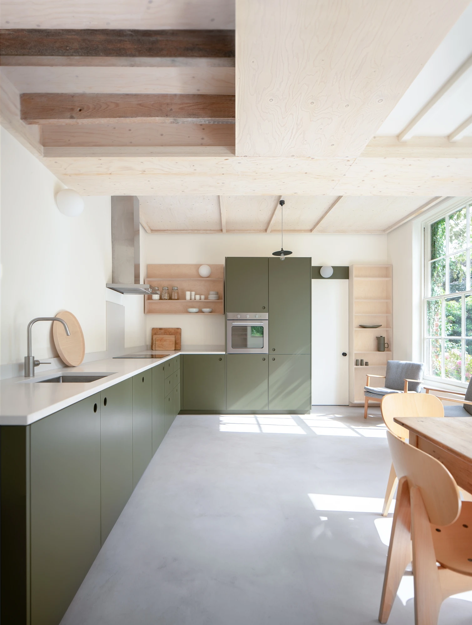 Garden Studio kitchen featuring custom cabinetry and open shelving