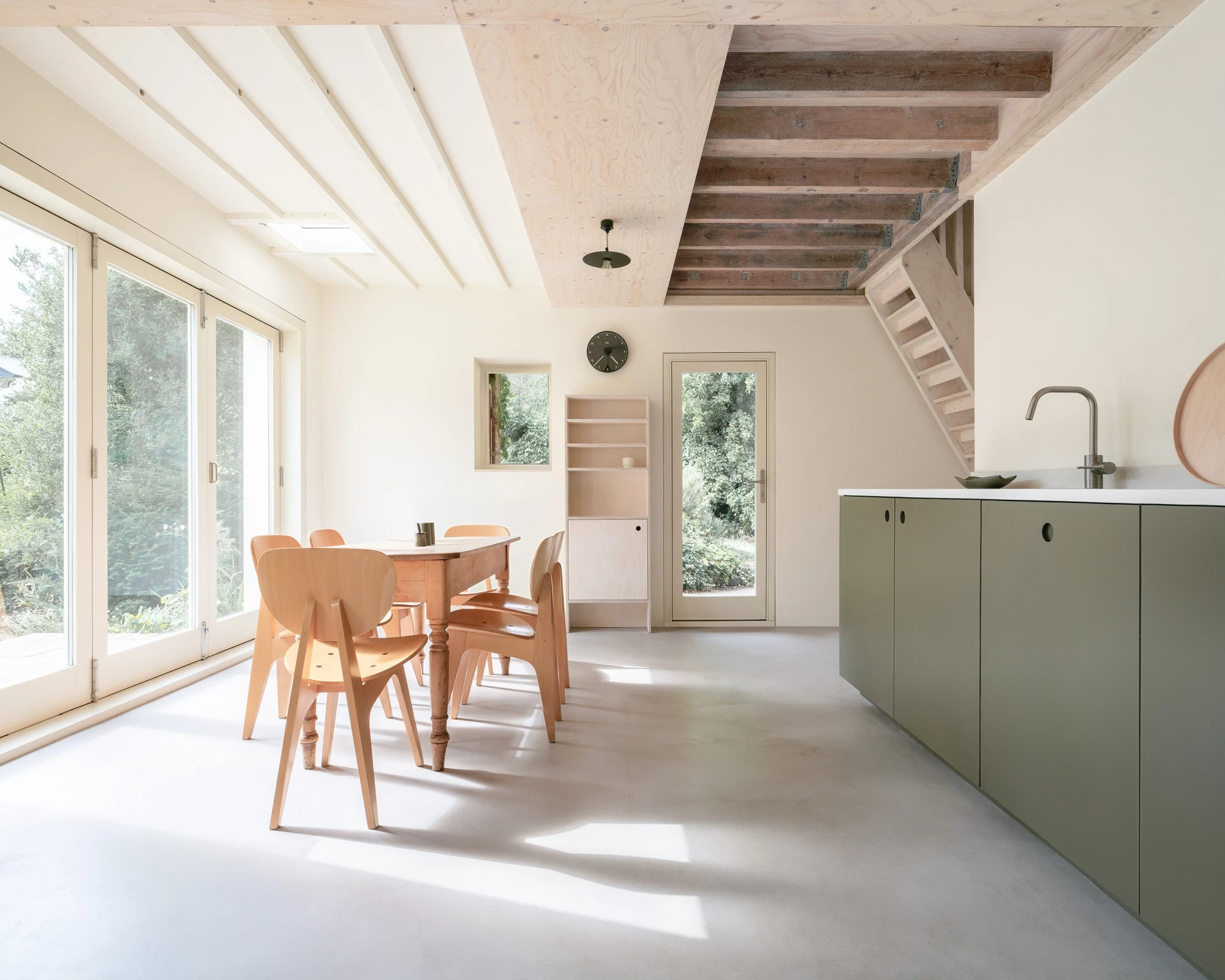 Wide view of the Garden Studio kitchen with dining area