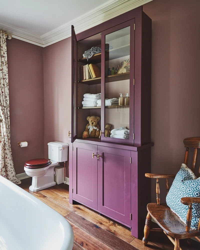 Stylish bathroom with purple part shaker and park glazed cabinet