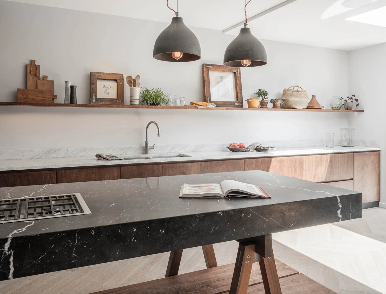 The Highgate kitchen's luxurious details elevate its elegance, from the central marble island that adds a touch of nature to the recessed lighting that casts a soft glow. These elements enhance the kitchen's overall aesthetic, creating a space that is both functional and visually captivating.