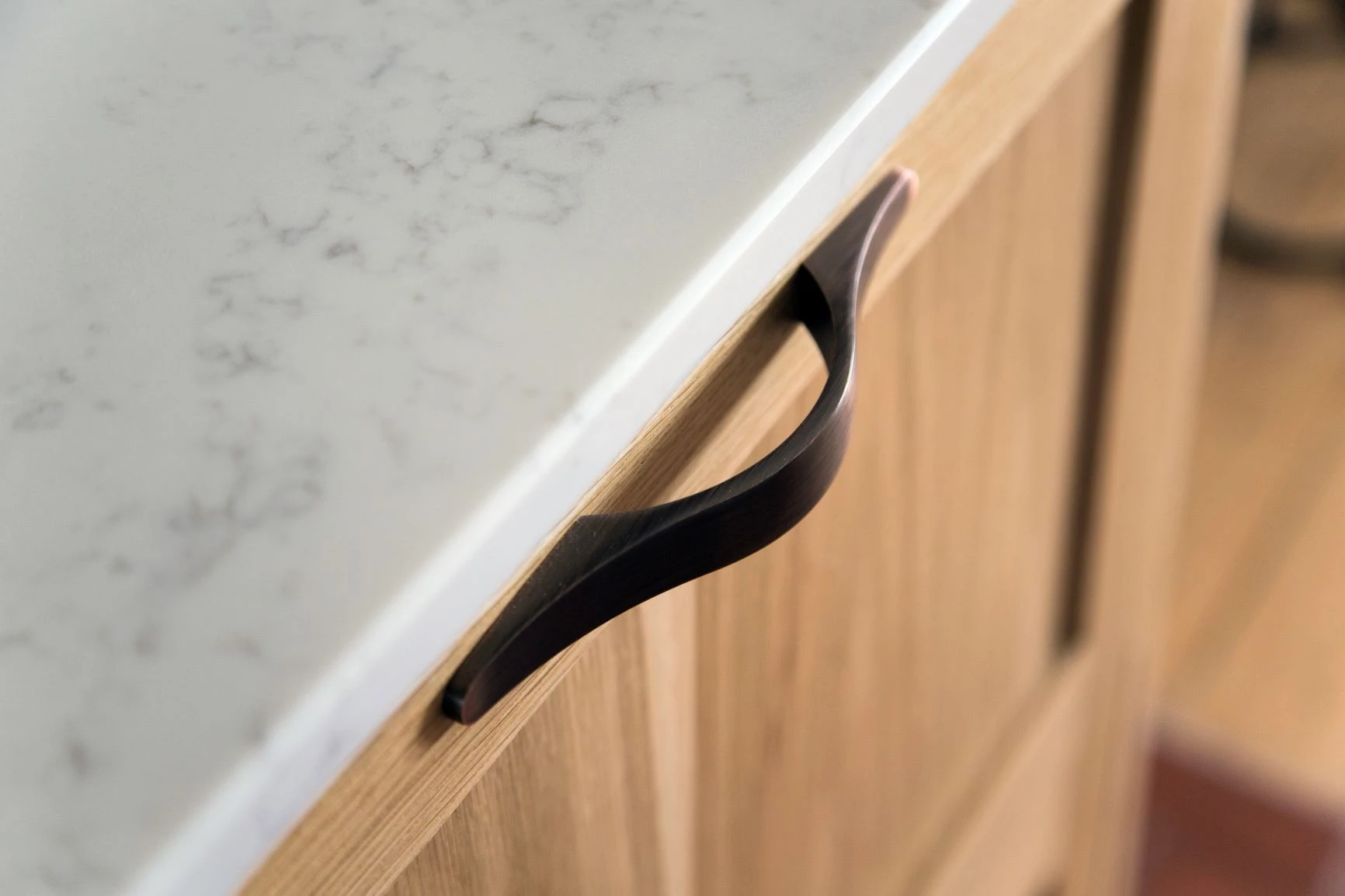 Stowed-away supper trays in sleek oak drawers seamlessly extend mealtime options without cluttering the countertop.