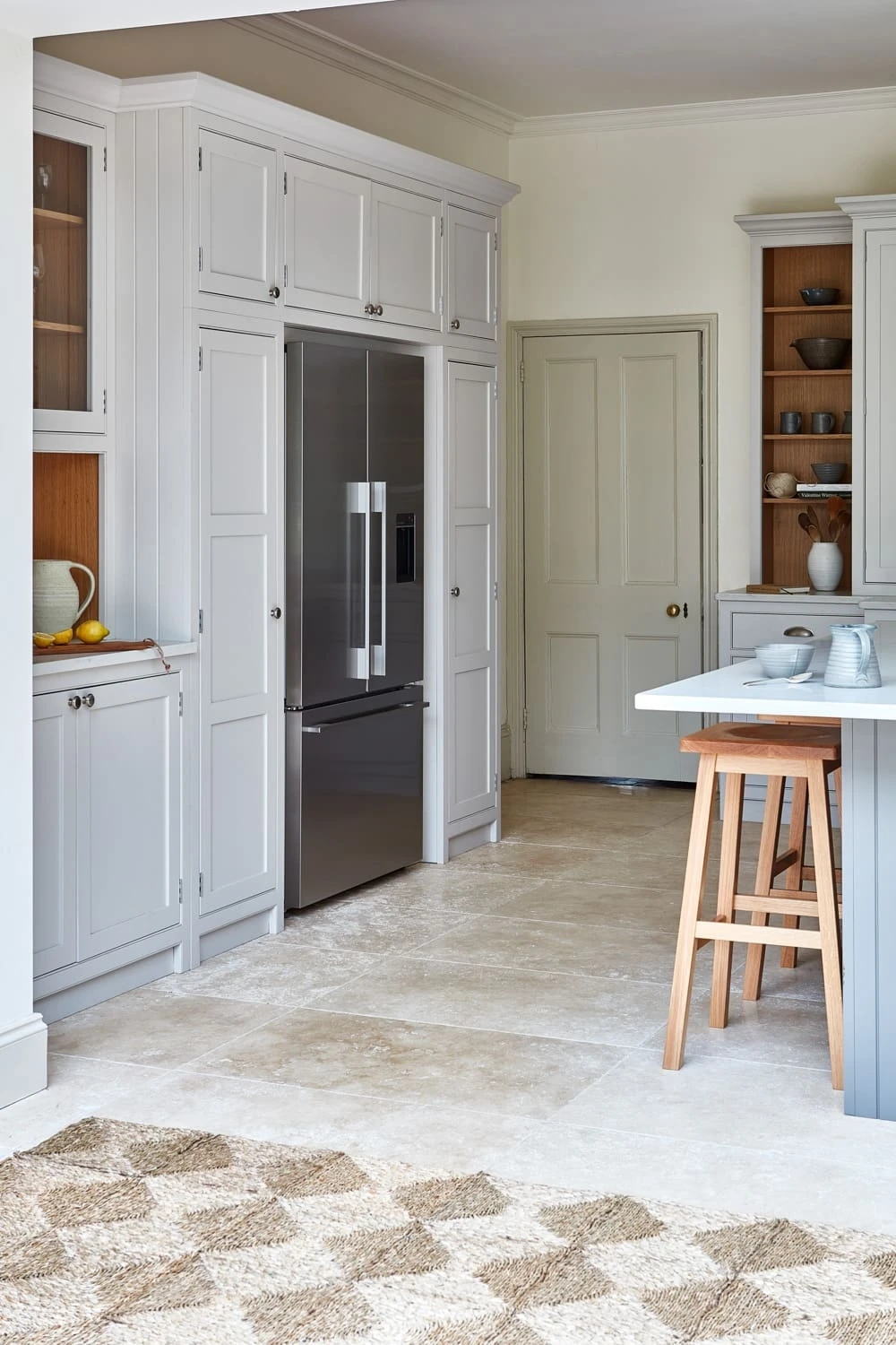 Eye catching modern appliance surrounded by beautiful shaker cabinetry.