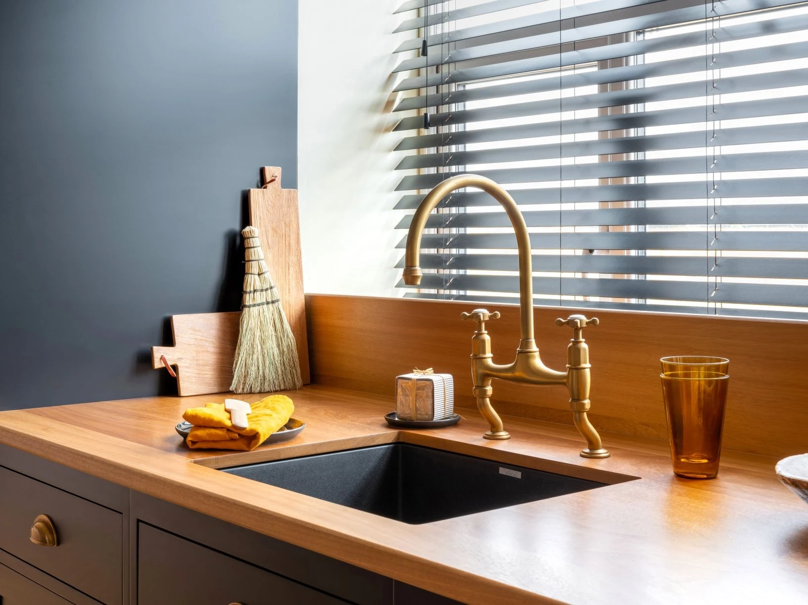 A traditional-style faucet adds a touch of timeless charm to the modern sink, seamlessly blending into the overall aesthetic and celebrating the marriage of old and new.