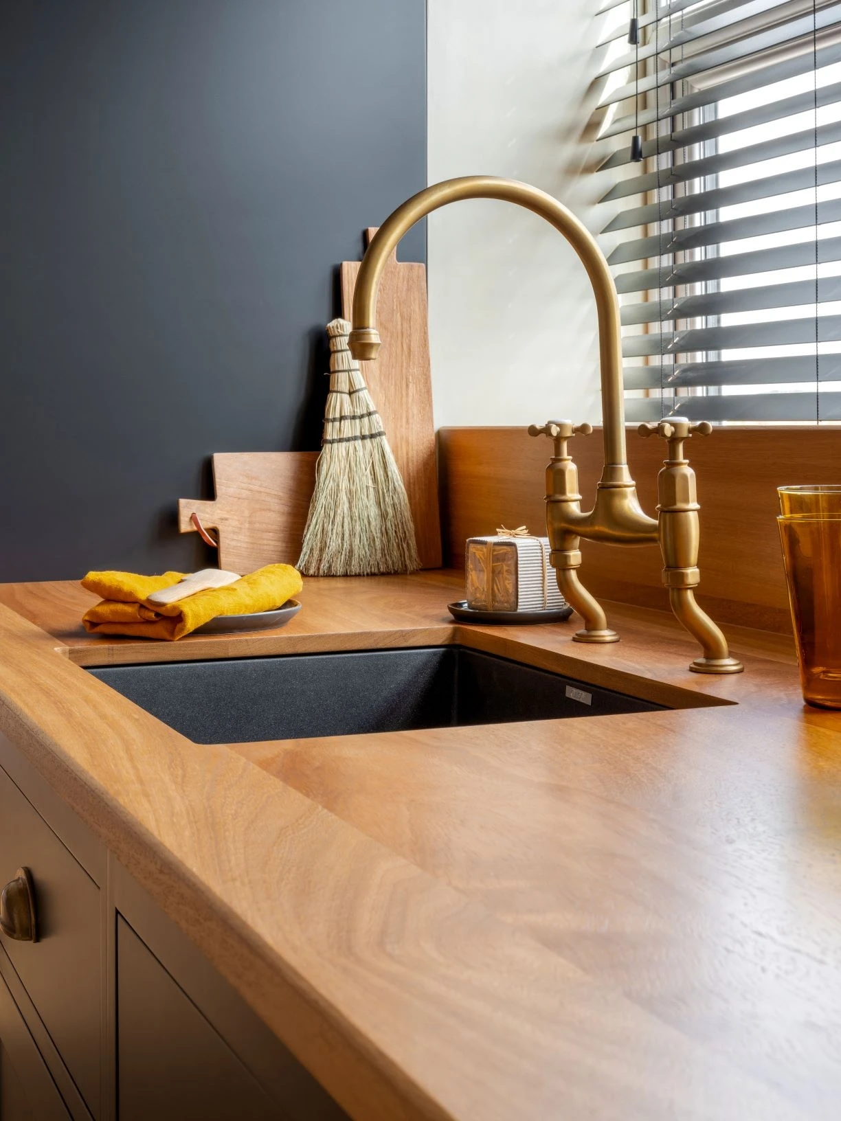 A traditional-style faucet adds a touch of timeless charm to the modern sink, seamlessly blending into the overall aesthetic and celebrating the marriage of old and new.