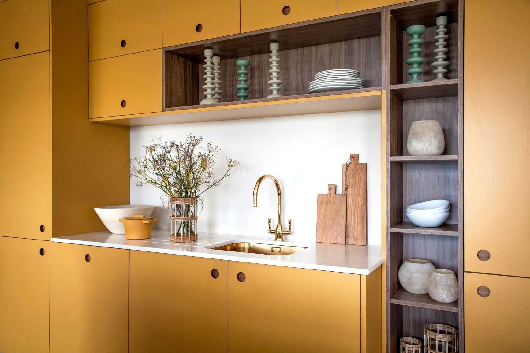 Deep cupboards with elegant Ladbroke handles offer ample and organized storage, keeping the kitchen clutter-free and stylish.