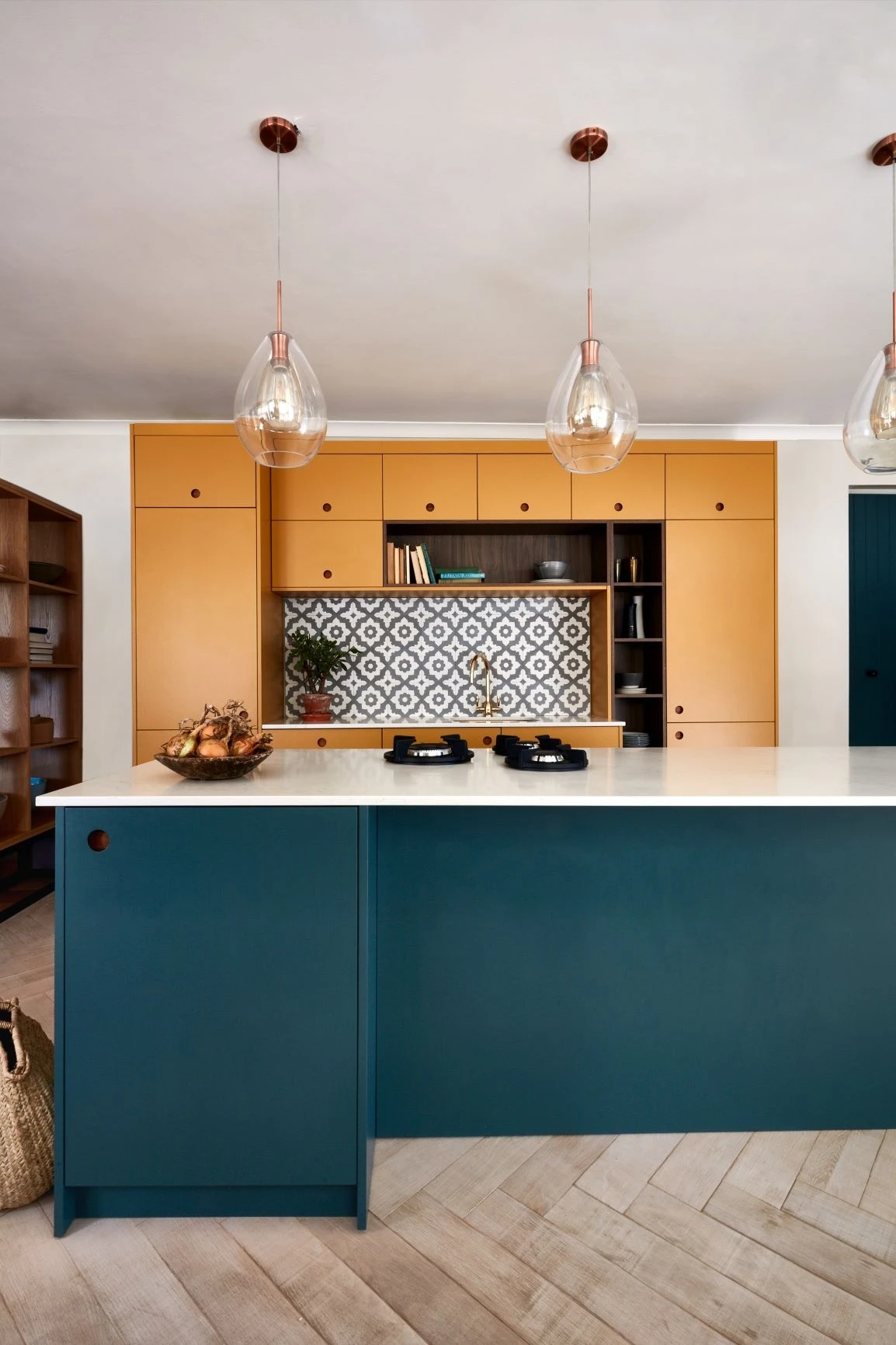 Ample countertop space is provided by sleek yellow surfaces, while tucked-away breakfast trays in walnut ensure effortless serving.