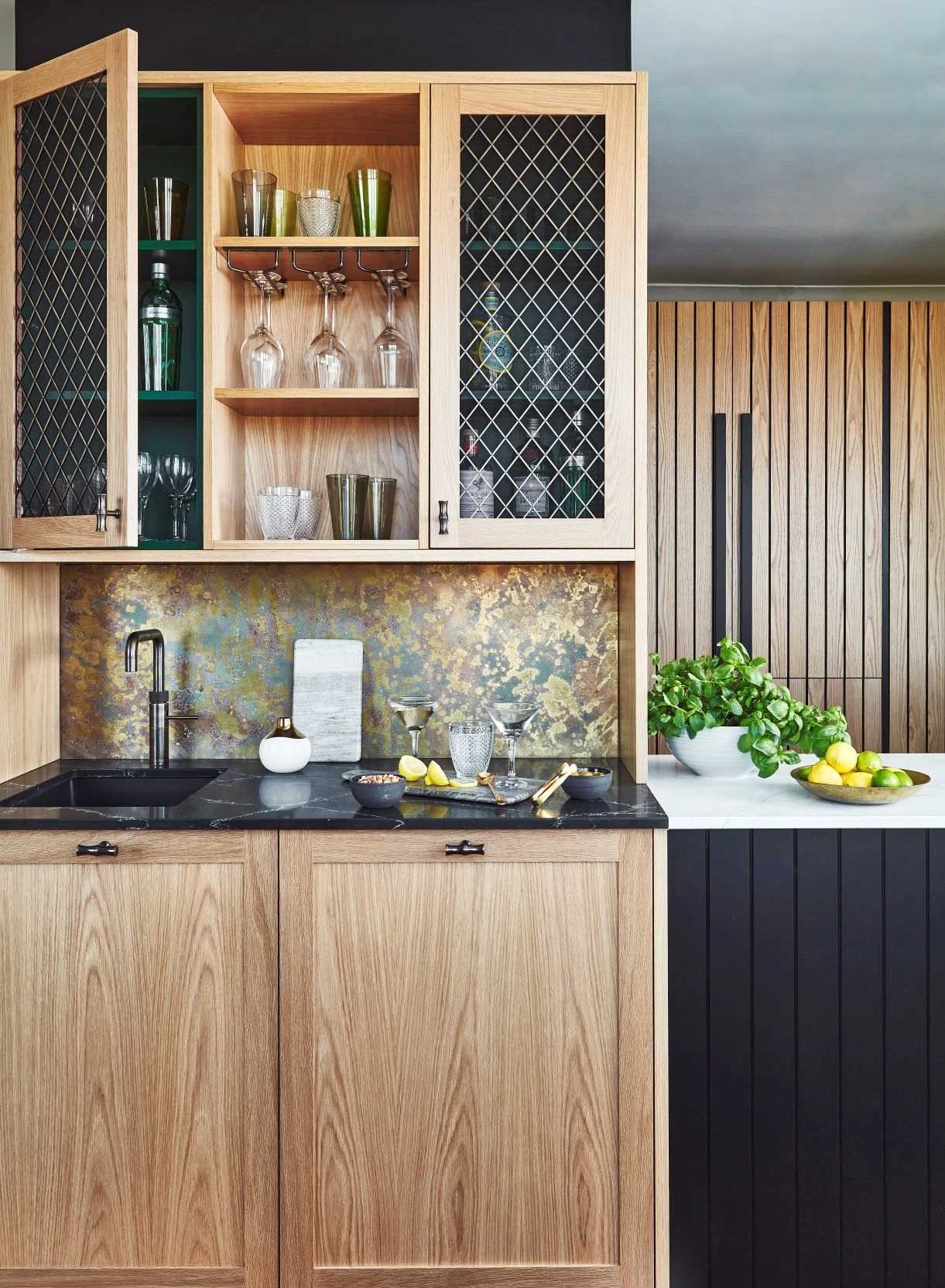 Enchanting bar area with a stunning black granite countertop, seamlessly integrated with the kitchen, creating a luxurious and inviting space for entertaining and relaxation.