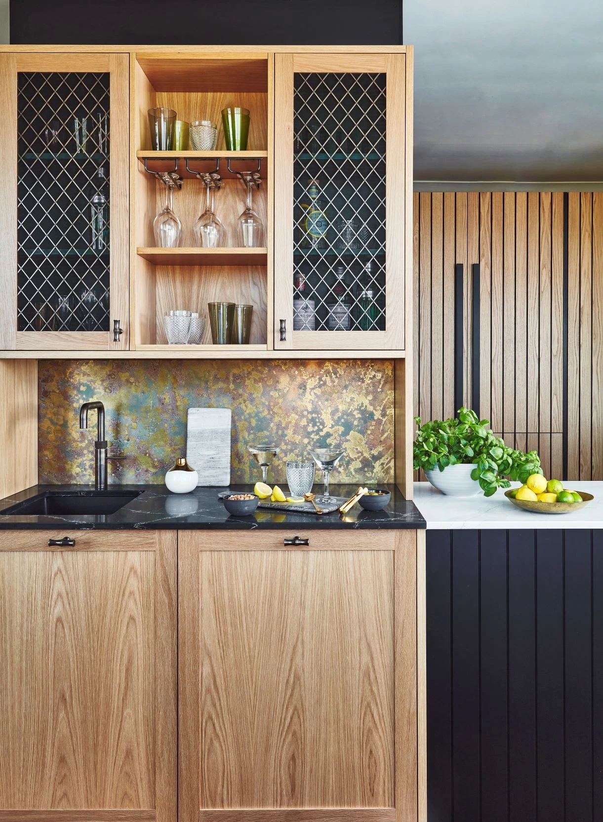 Enchanting bar area with a stunning black granite countertop, seamlessly integrated with the kitchen, creating a luxurious and inviting space for entertaining and relaxation.