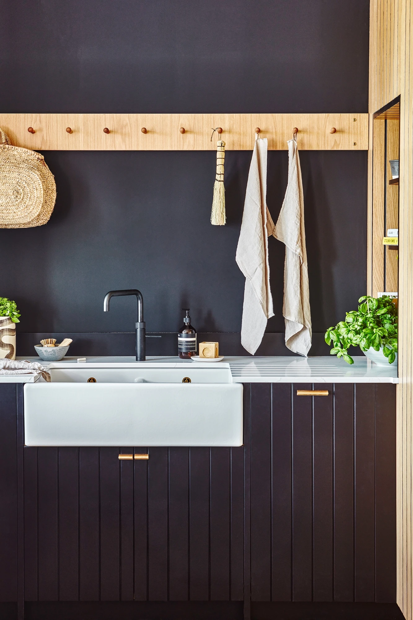 Close-up of the Kitchen's oak shaker peg rails, adding a functional and decorative element to the space, perfect for hanging utensils or towels.