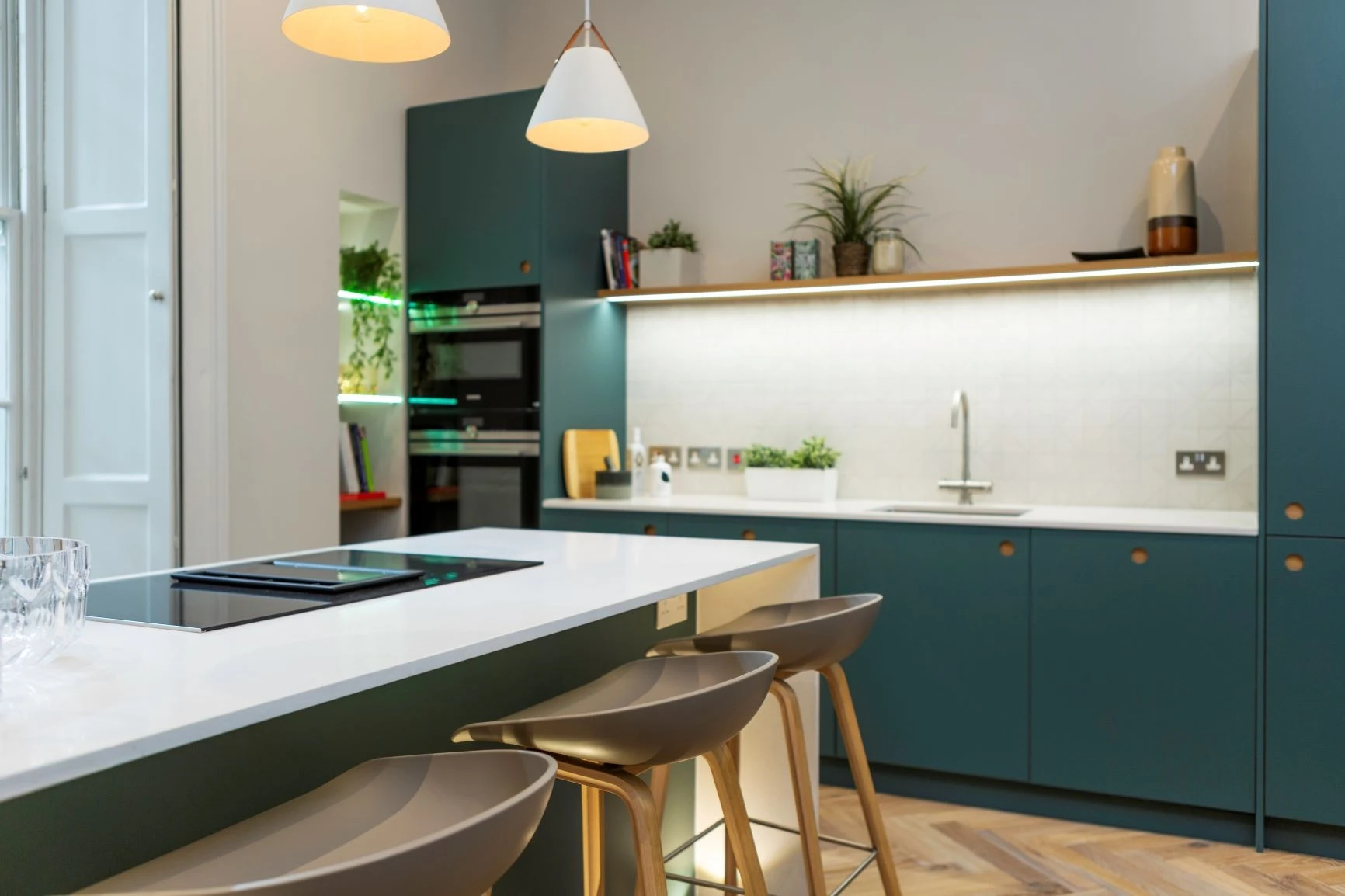 The Royal Mile kitchen exudes timeless elegance, blending dark blue cabinetry with white quartz countertops and a wrap-around island. The kitchen's simplicity and functionality make it a perfect centrepiece for any home.