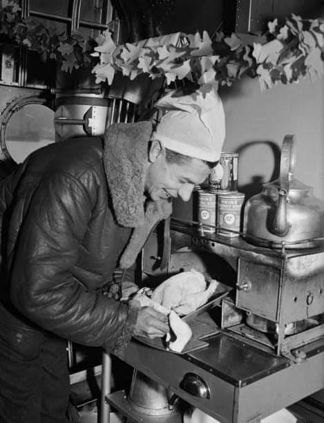 Crew member making a Christmas dinner on a Sunderland flying boat,