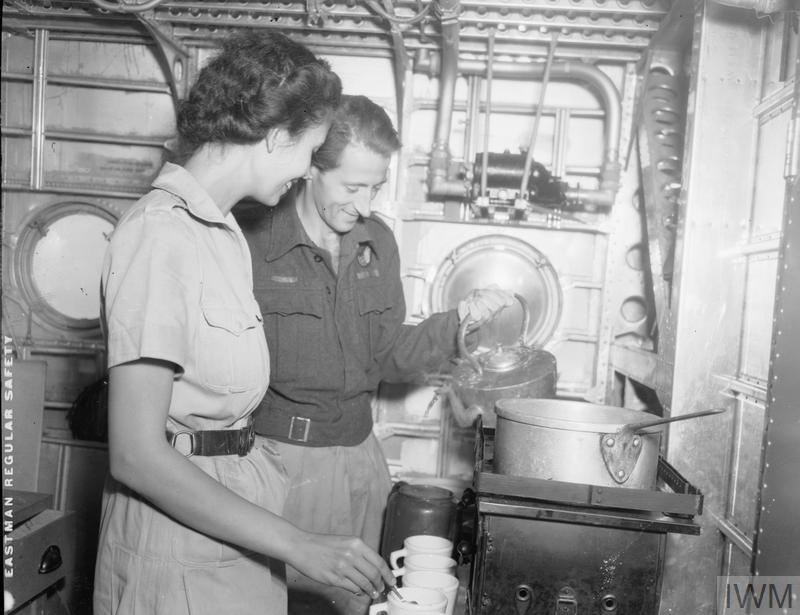 Crew members making a tea within the galley of a Sunderland flying boat,